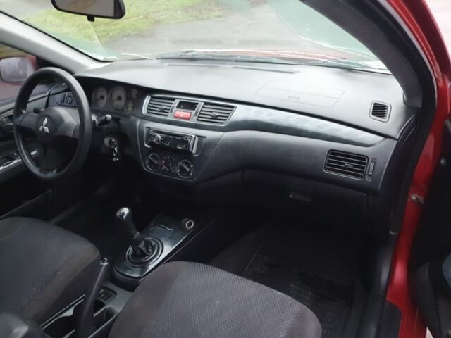 Красный Мицубиси Лансер, объемом двигателя 1.6 л и пробегом 250 тыс. км за 3700 $, фото 8 на Automoto.ua