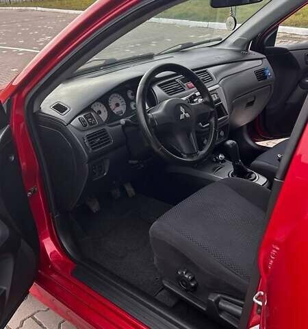 Красный Мицубиси Лансер, объемом двигателя 1.6 л и пробегом 176 тыс. км за 4300 $, фото 11 на Automoto.ua