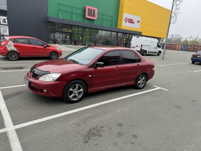 Красный Мицубиси Лансер, объемом двигателя 1.6 л и пробегом 285 тыс. км за 3650 $, фото 4 на Automoto.ua