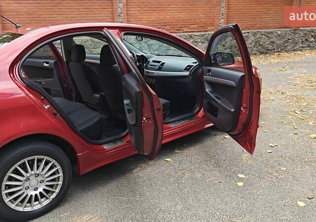 Міцубісі Lancer 2007 у Києві на Automoto.ua Червоний Міцубісі Lancer, об'ємом двигуна 2 л та пробігом 186 тис. км за 5600 $, фото 13 на Automoto.ua