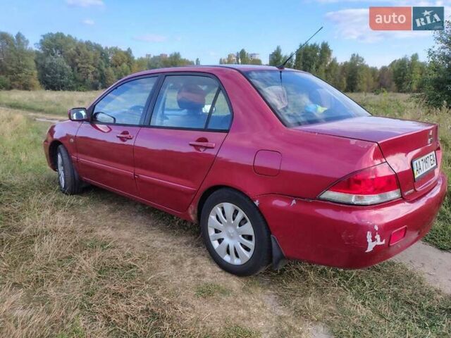 Красный Мицубиси Лансер, объемом двигателя 1.58 л и пробегом 264 тыс. км за 3900 $, фото 5 на Automoto.ua