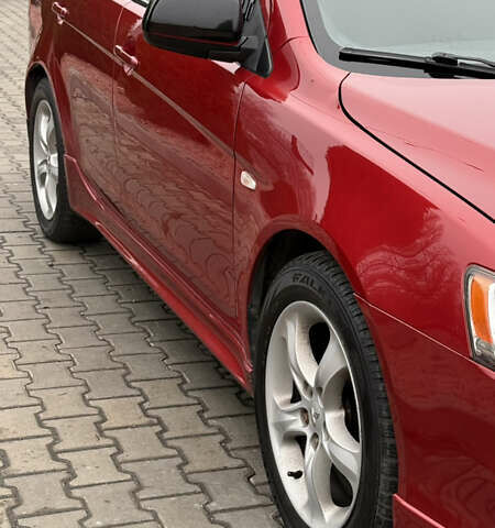 Красный Мицубиси Лансер, объемом двигателя 2 л и пробегом 261 тыс. км за 7200 $, фото 3 на Automoto.ua