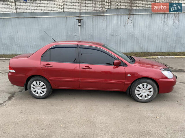 Червоний Міцубісі Lancer, об'ємом двигуна 1.58 л та пробігом 151 тис. км за 5600 $, фото 8 на Automoto.ua