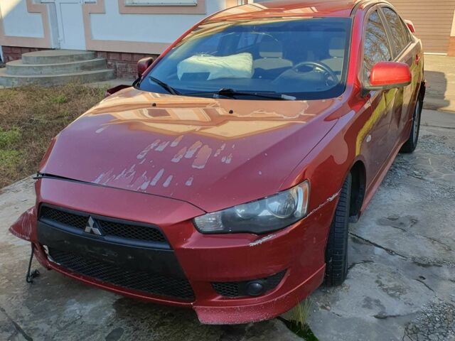 Красный Мицубиси Лансер, объемом двигателя 2 л и пробегом 406 тыс. км за 2750 $, фото 1 на Automoto.ua