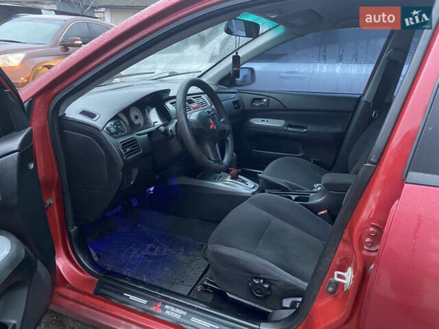 Красный Мицубиси Лансер, объемом двигателя 1.58 л и пробегом 269 тыс. км за 3899 $, фото 6 на Automoto.ua