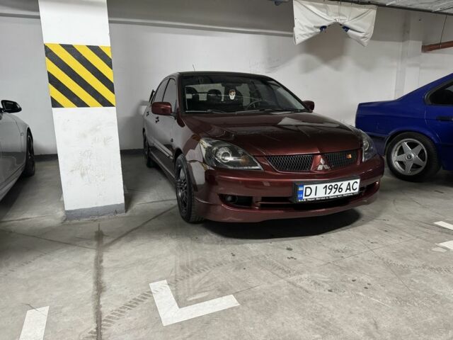 Красный Мицубиси Лансер, объемом двигателя 2 л и пробегом 3 тыс. км за 5800 $, фото 18 на Automoto.ua