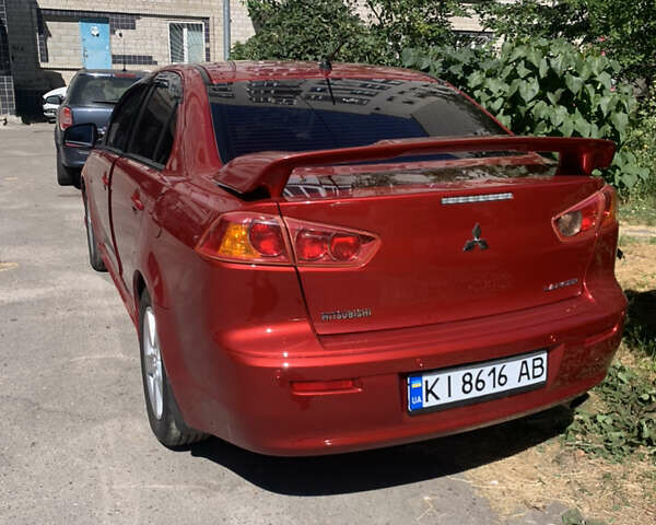 Красный Мицубиси Лансер, объемом двигателя 2 л и пробегом 142 тыс. км за 7000 $, фото 12 на Automoto.ua