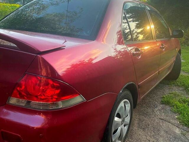 Червоний Міцубісі Lancer, об'ємом двигуна 1.6 л та пробігом 185 тис. км за 3900 $, фото 1 на Automoto.ua