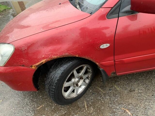 Червоний Міцубісі Lancer, об'ємом двигуна 1.6 л та пробігом 300 тис. км за 2799 $, фото 7 на Automoto.ua