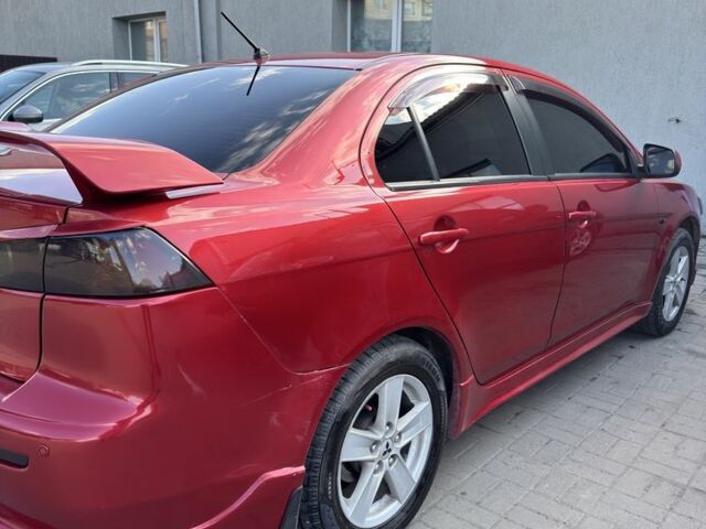 Красный Мицубиси Лансер, объемом двигателя 2 л и пробегом 267 тыс. км за 7000 $, фото 5 на Automoto.ua