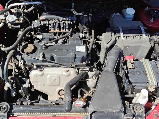 Красный Мицубиси Лансер, объемом двигателя 1.6 л и пробегом 216 тыс. км за 4500 $, фото 11 на Automoto.ua