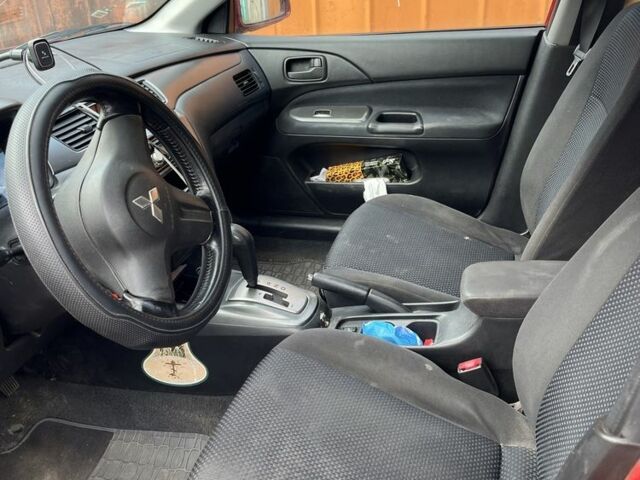 Красный Мицубиси Лансер, объемом двигателя 1.6 л и пробегом 3 тыс. км за 3000 $, фото 6 на Automoto.ua