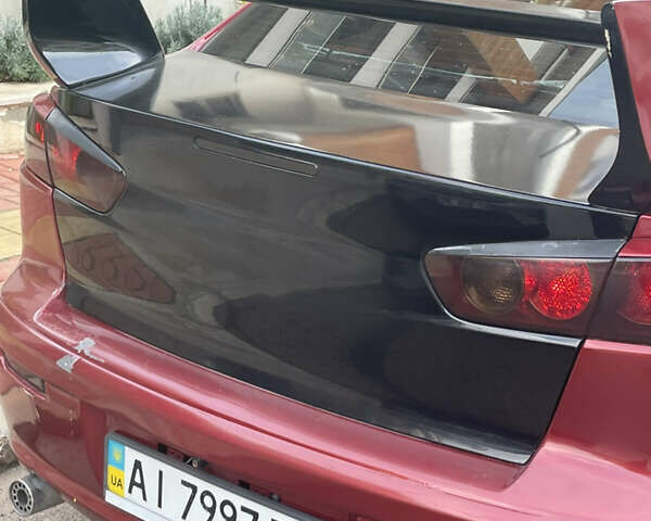 Красный Мицубиси Лансер, объемом двигателя 2 л и пробегом 275 тыс. км за 5500 $, фото 3 на Automoto.ua