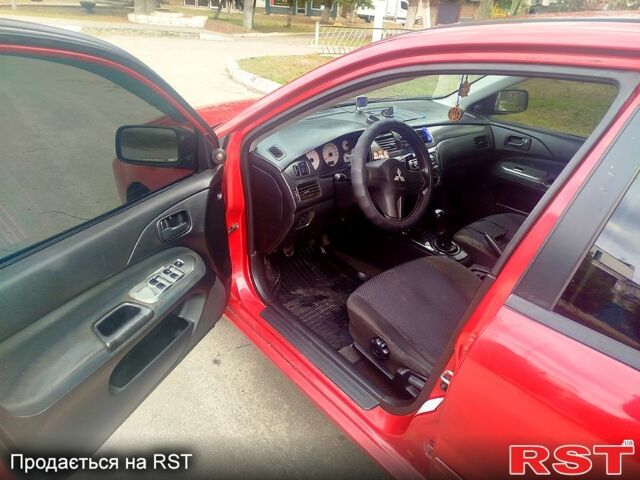 Красный Мицубиси Лансер, объемом двигателя 1.6 л и пробегом 174 тыс. км за 4700 $, фото 4 на Automoto.ua