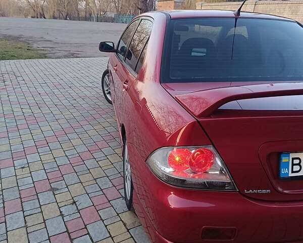 Червоний Міцубісі Lancer, об'ємом двигуна 2 л та пробігом 265 тис. км за 4300 $, фото 13 на Automoto.ua