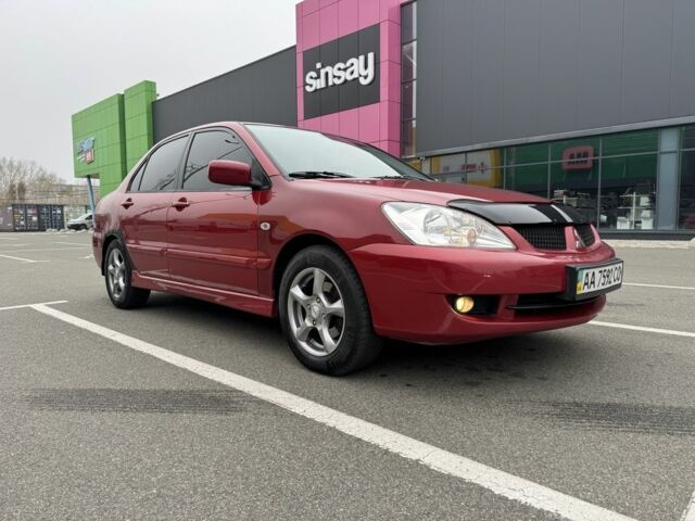 Красный Мицубиси Лансер, объемом двигателя 1.6 л и пробегом 285 тыс. км за 3650 $, фото 1 на Automoto.ua