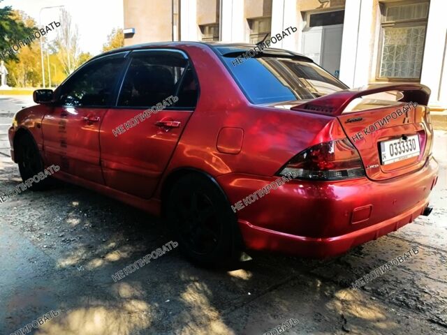 Красный Мицубиси Лансер, объемом двигателя 0 л и пробегом 252 тыс. км за 5400 $, фото 4 на Automoto.ua