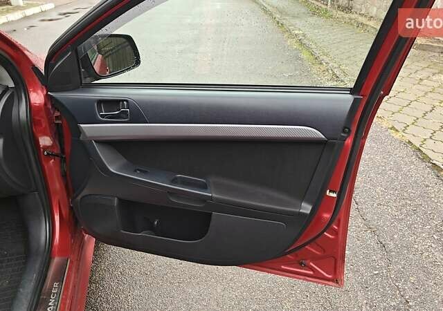Червоний Міцубісі Lancer, об'ємом двигуна 2 л та пробігом 187 тис. км за 5600 $, фото 19 на Automoto.ua