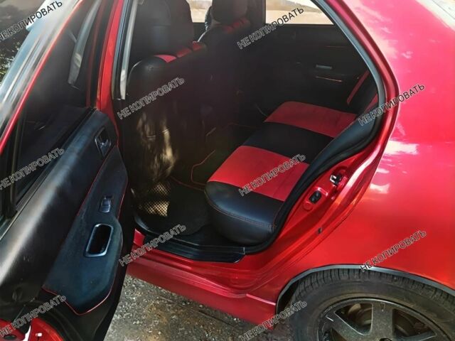 Красный Мицубиси Лансер, объемом двигателя 0 л и пробегом 252 тыс. км за 5400 $, фото 2 на Automoto.ua