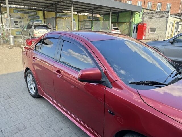 Красный Мицубиси Лансер, объемом двигателя 2 л и пробегом 267 тыс. км за 7000 $, фото 10 на Automoto.ua