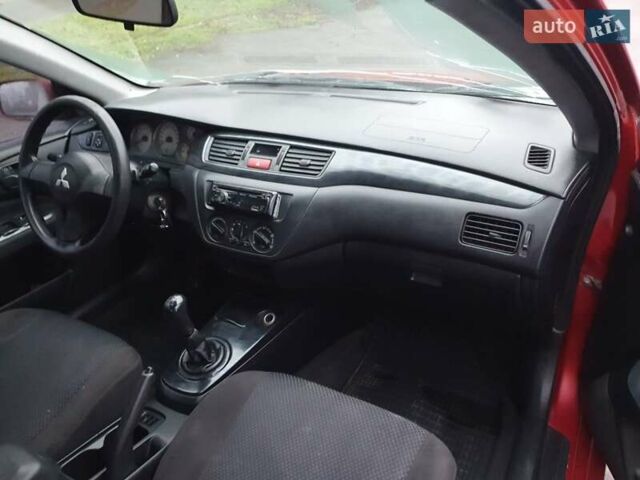 Красный Мицубиси Лансер, объемом двигателя 1.6 л и пробегом 250 тыс. км за 3700 $, фото 8 на Automoto.ua
