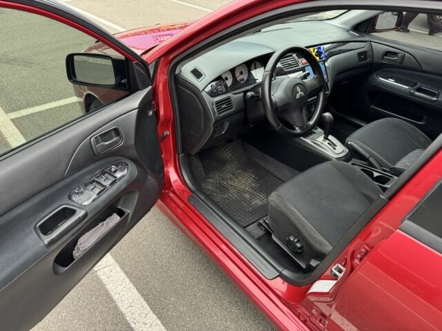 Красный Мицубиси Лансер, объемом двигателя 1.6 л и пробегом 285 тыс. км за 3650 $, фото 9 на Automoto.ua