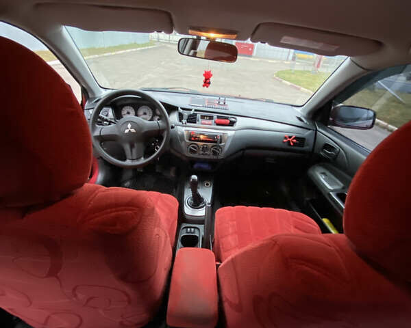 Червоний Міцубісі Lancer, об'ємом двигуна 1.58 л та пробігом 151 тис. км за 5600 $, фото 14 на Automoto.ua