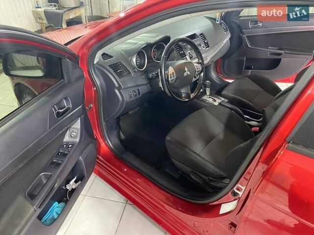 Красный Мицубиси Лансер, объемом двигателя 2 л и пробегом 66 тыс. км за 10000 $, фото 5 на Automoto.ua