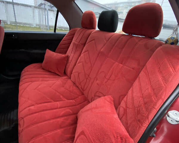 Червоний Міцубісі Lancer, об'ємом двигуна 1.58 л та пробігом 151 тис. км за 5600 $, фото 11 на Automoto.ua