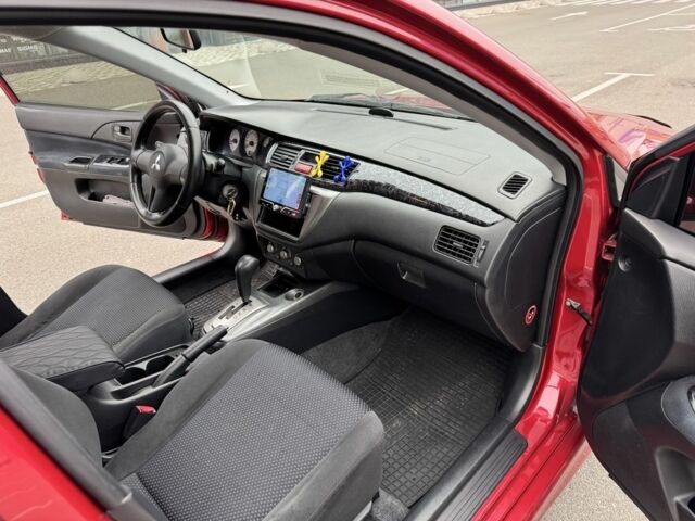 Красный Мицубиси Лансер, объемом двигателя 1.6 л и пробегом 285 тыс. км за 3650 $, фото 13 на Automoto.ua