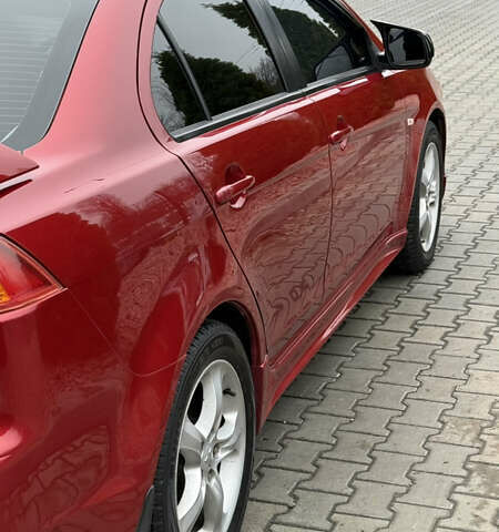 Красный Мицубиси Лансер, объемом двигателя 2 л и пробегом 261 тыс. км за 7200 $, фото 4 на Automoto.ua