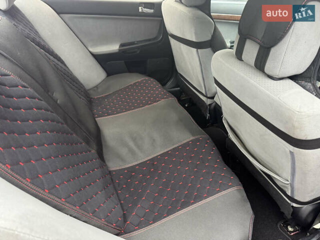 Червоний Міцубісі Lancer, об'ємом двигуна 1.5 л та пробігом 205 тис. км за 5900 $, фото 9 на Automoto.ua