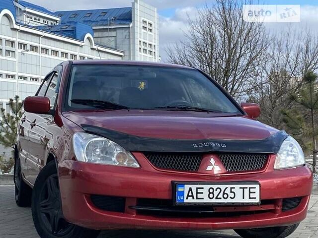Красный Мицубиси Лансер, объемом двигателя 1.6 л и пробегом 242 тыс. км за 4999 $, фото 8 на Automoto.ua