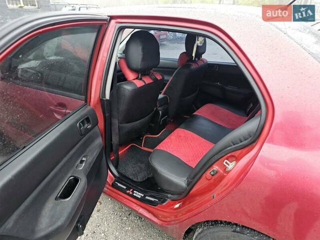 Червоний Міцубісі Lancer, об'ємом двигуна 1.6 л та пробігом 267 тис. км за 2999 $, фото 9 на Automoto.ua