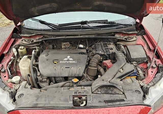 Червоний Міцубісі Lancer, об'ємом двигуна 2 л та пробігом 186 тис. км за 5600 $, фото 26 на Automoto.ua
