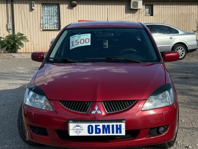 Красный Мицубиси Лансер, объемом двигателя 1.6 л и пробегом 230 тыс. км за 5300 $, фото 1 на Automoto.ua