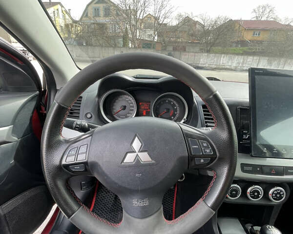 Червоний Міцубісі Lancer, об'ємом двигуна 2 л та пробігом 241 тис. км за 7800 $, фото 10 на Automoto.ua