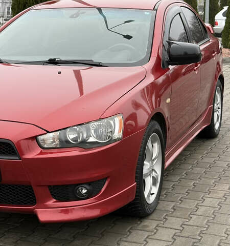Красный Мицубиси Лансер, объемом двигателя 2 л и пробегом 261 тыс. км за 7200 $, фото 1 на Automoto.ua