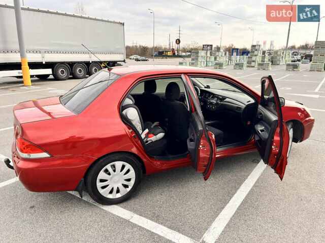 Червоний Міцубісі Lancer, об'ємом двигуна 1.6 л та пробігом 194 тис. км за 5500 $, фото 7 на Automoto.ua
