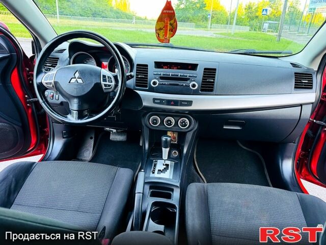 Красный Мицубиси Лансер, объемом двигателя 2 л и пробегом 180 тыс. км за 6500 $, фото 6 на Automoto.ua