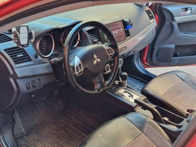 Красный Мицубиси Лансер, объемом двигателя 2 л и пробегом 274 тыс. км за 6000 $, фото 3 на Automoto.ua