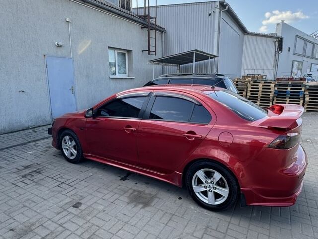 Красный Мицубиси Лансер, объемом двигателя 2 л и пробегом 267 тыс. км за 7000 $, фото 8 на Automoto.ua