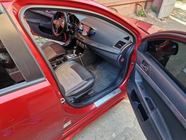 Красный Мицубиси Лансер, объемом двигателя 2 л и пробегом 274 тыс. км за 6000 $, фото 1 на Automoto.ua