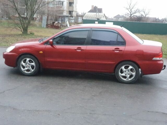 Красный Мицубиси Лансер, объемом двигателя 1.6 л и пробегом 250 тыс. км за 3700 $, фото 6 на Automoto.ua