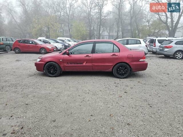Червоний Міцубісі Lancer, об'ємом двигуна 1.6 л та пробігом 267 тис. км за 2999 $, фото 6 на Automoto.ua