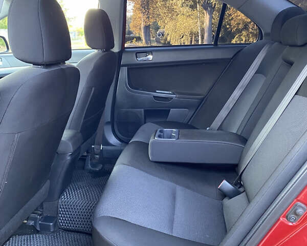 Червоний Міцубісі Lancer, об'ємом двигуна 2 л та пробігом 153 тис. км за 6700 $, фото 13 на Automoto.ua