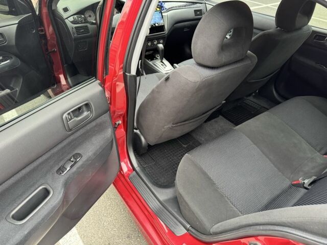 Красный Мицубиси Лансер, объемом двигателя 1.6 л и пробегом 285 тыс. км за 3650 $, фото 12 на Automoto.ua