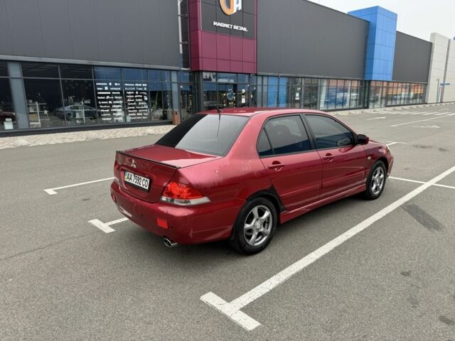 Красный Мицубиси Лансер, объемом двигателя 1.6 л и пробегом 285 тыс. км за 3650 $, фото 6 на Automoto.ua