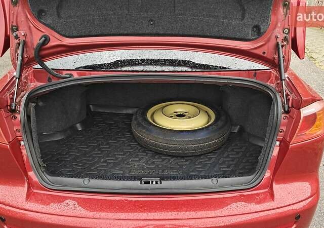 Червоний Міцубісі Lancer, об'ємом двигуна 2 л та пробігом 186 тис. км за 5600 $, фото 25 на Automoto.ua