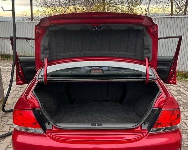 Красный Мицубиси Лансер, объемом двигателя 1.6 л и пробегом 176 тыс. км за 4300 $, фото 24 на Automoto.ua